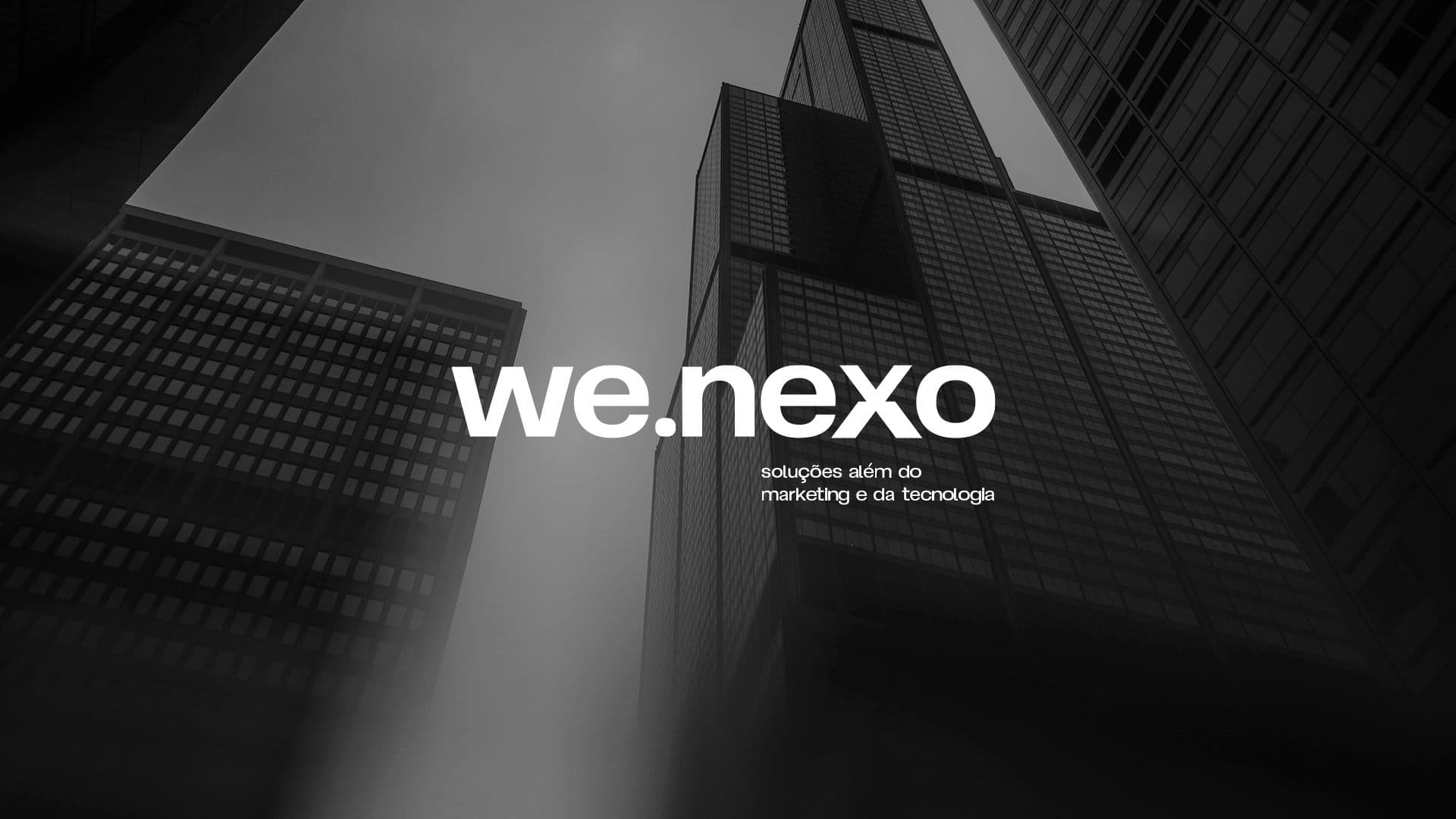 Wallpaper we.nexo com fotografia vertical de torres corporativas em preto e branco